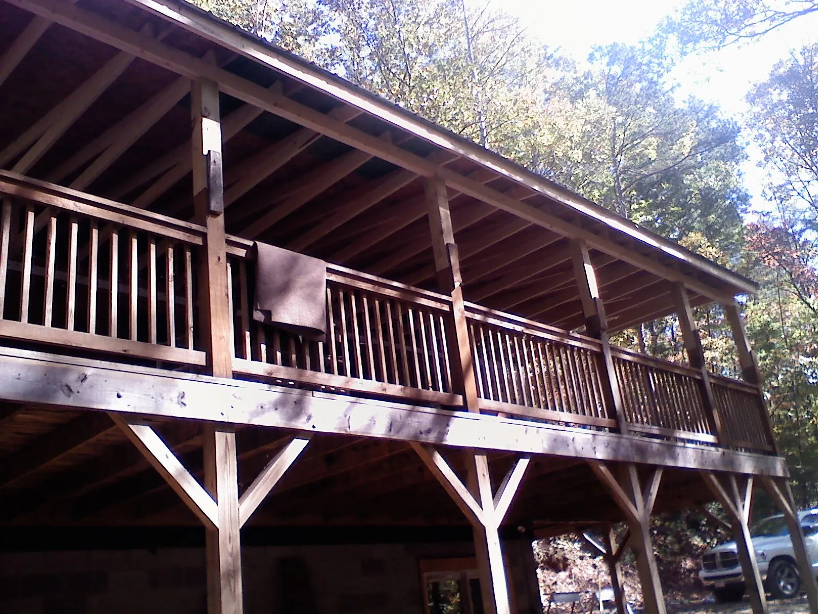 Timber framing under a new elevated porch and deck — Roof Leak Repair in Liberty Center by Roofing Brothers